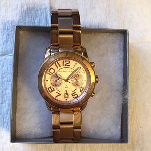 Michael kors rose gold watch.